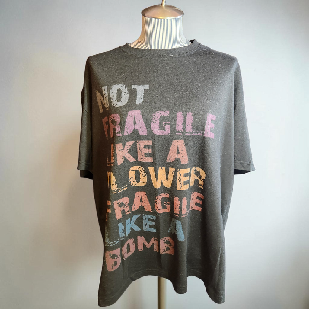 "Not fragile like a flower" Value Funny Tee