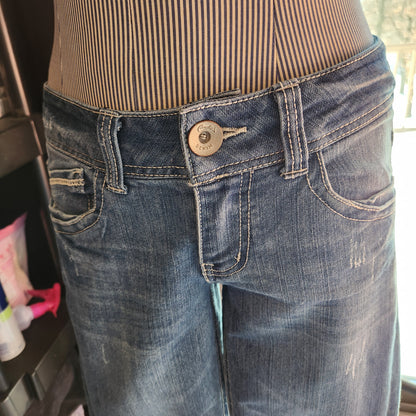 Candies Jeans with stenciling and bedazzled on back.